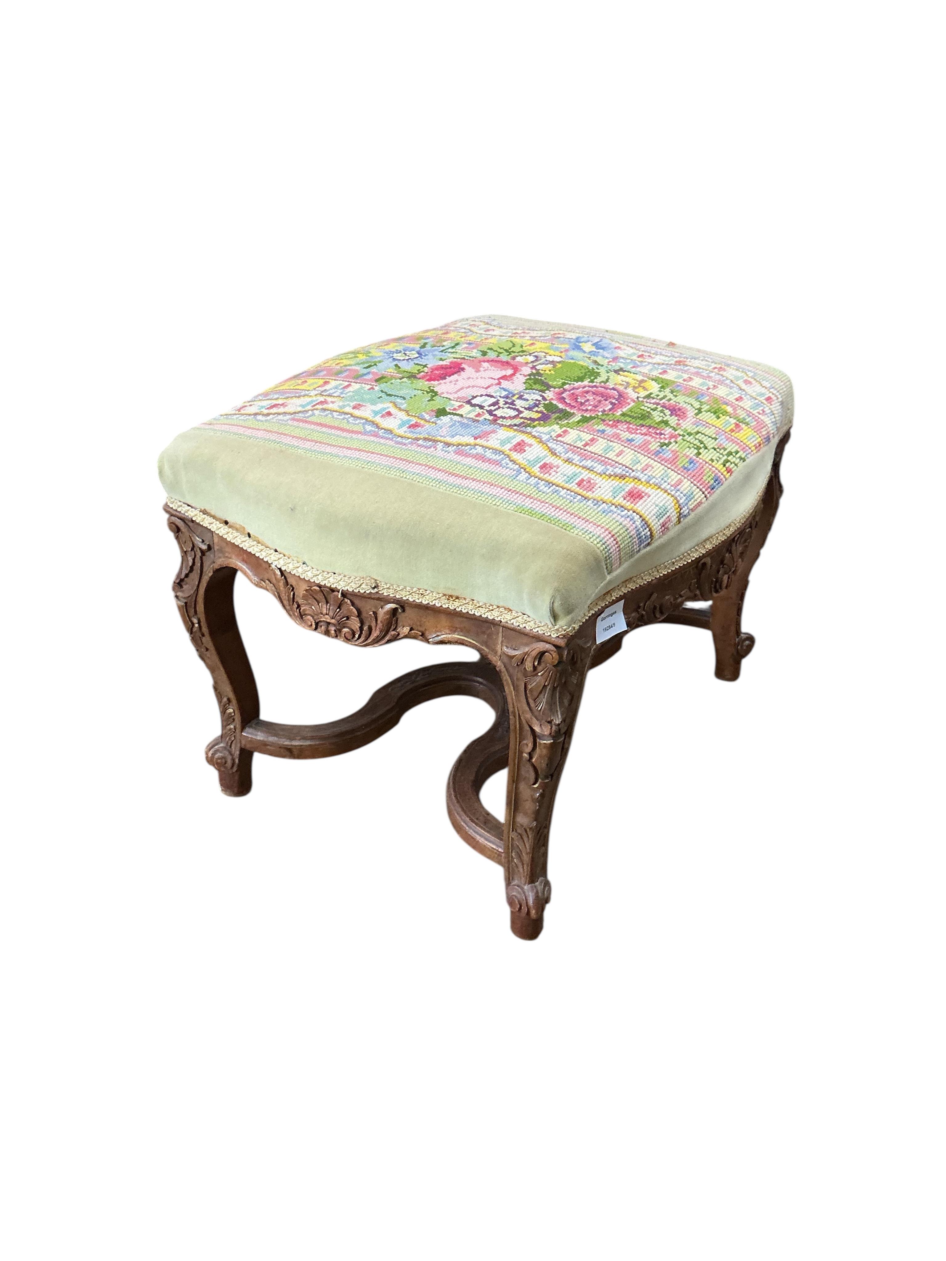 A 19th century French carved walnut dressing stool, with a tapestry upholstered top, width 62cm, depth 48cm, height 44cm